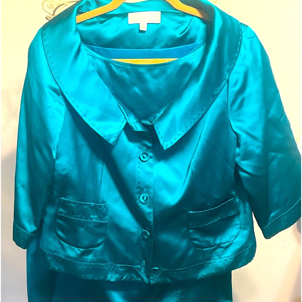 Badgley Mischa is a vibrant teal two-piece ensemble a shiny, satin-like fabric